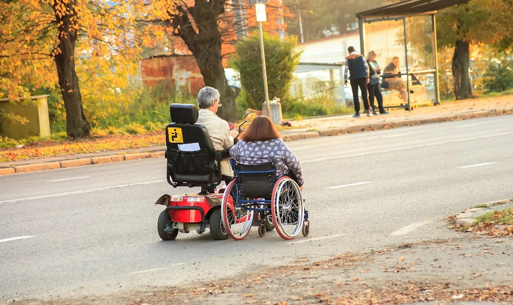Wheelchair and Mobility Scooter on the Road